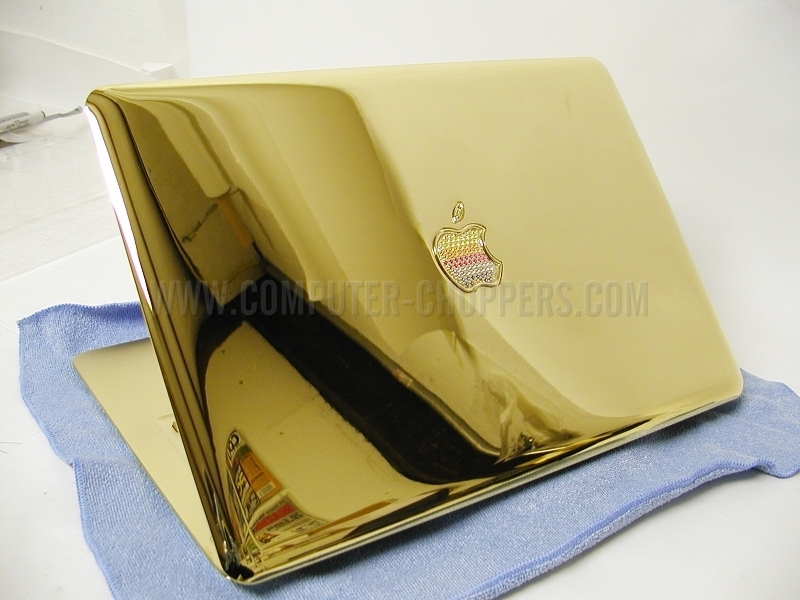 Illustration for article titled Gold MacBook Air Has Bejeweled Rainbow Apple